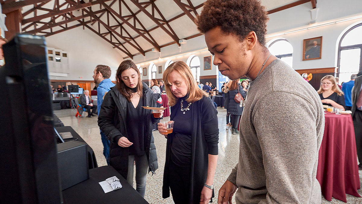 Students present their work in Colgate's Entrepreneurship program in the Hall of Presidents, James C. Colgate Hall