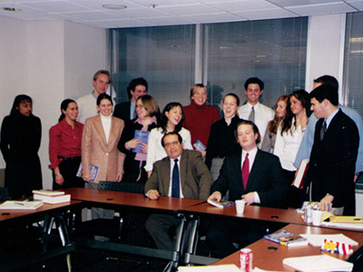 Group of students gathered around desk