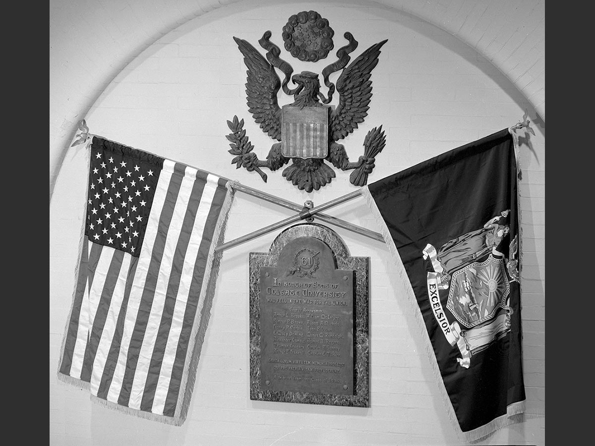 Plaque with national and New York State flags above