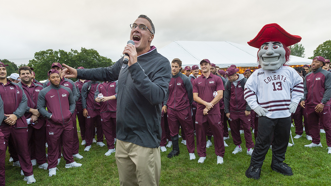 Head Football Coach Dan Hunt speaks at pep rally