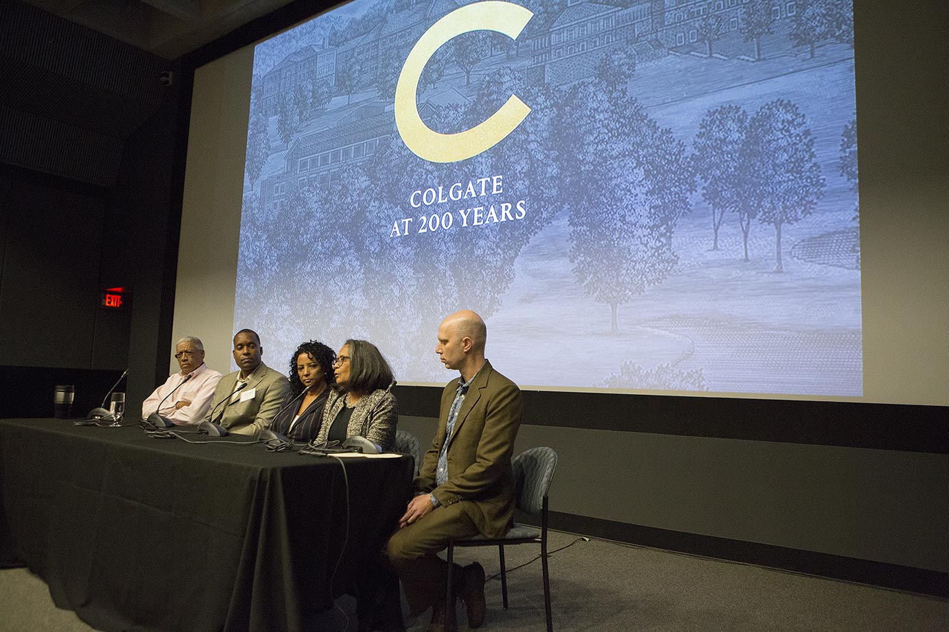 Panel in front of screen with bicentennial logo