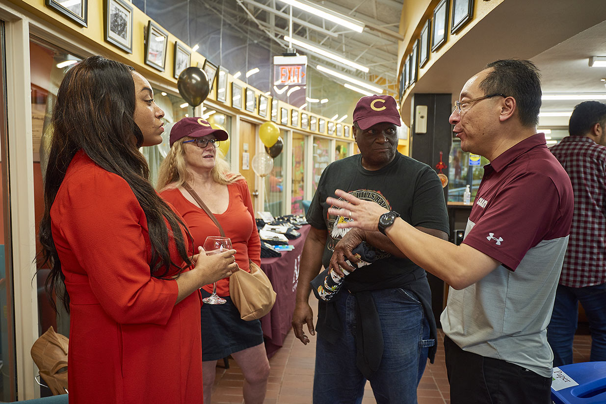 Group talking wearing Colgate gear