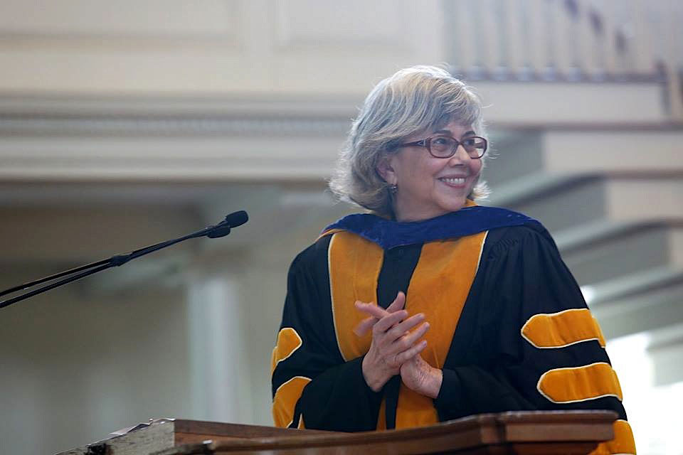 Jill Harsin at a podium during the baccalaureate ceremony