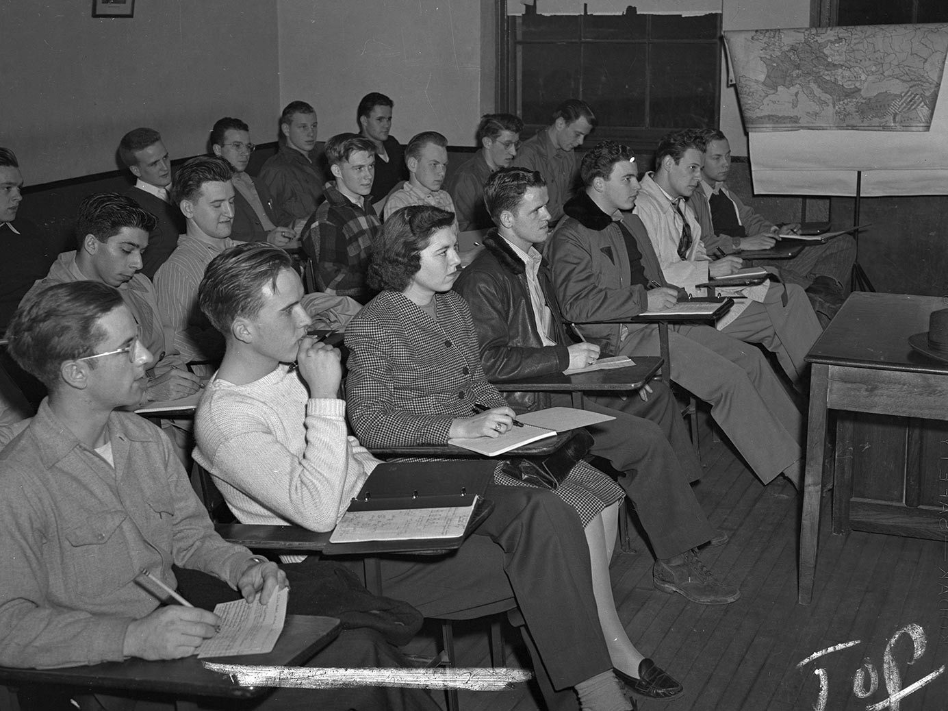 Vintage photo of classroom with Helen Craven Mues as the only female student